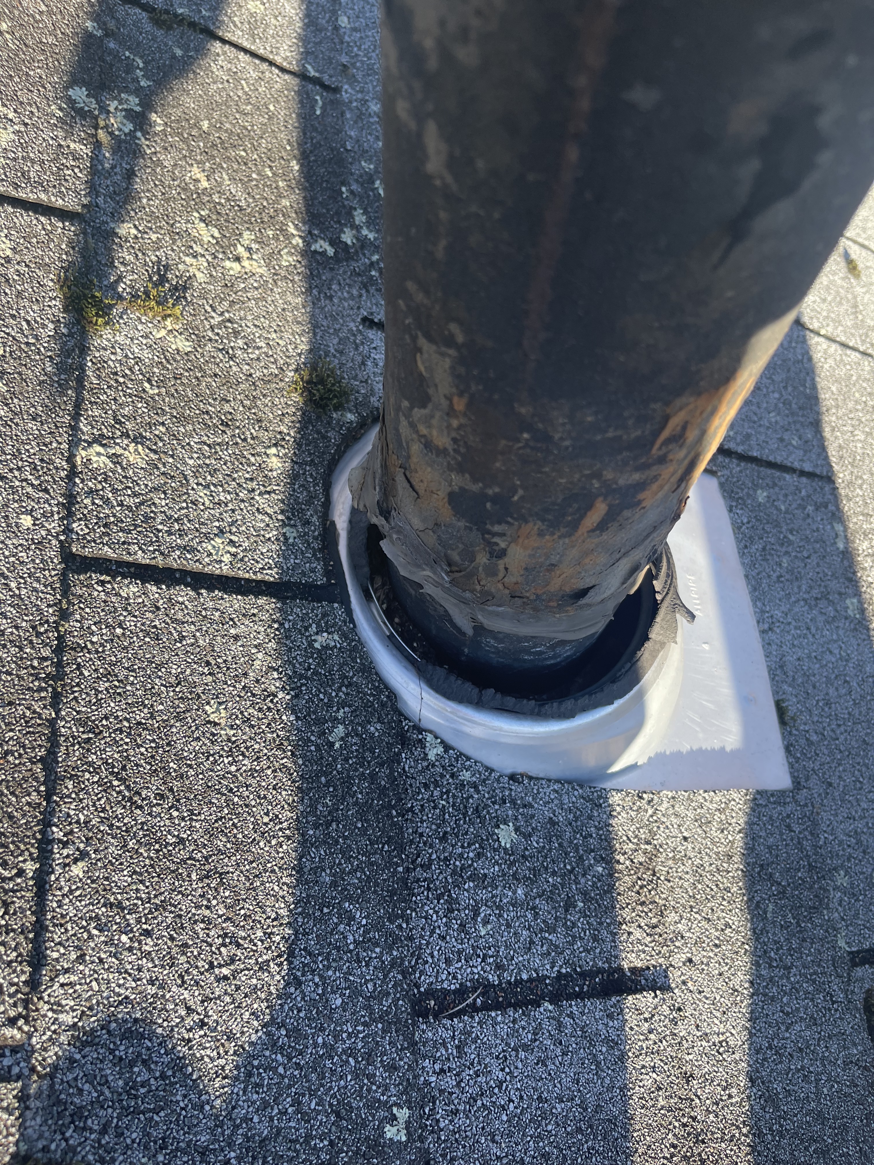 Torn roof pipe flashing